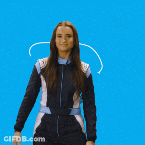 A Woman In A Blue And White Jumpsuit Is Smiling GIF