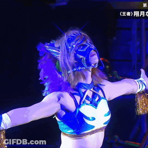 A Woman In A Blue And White Outfit With A Mask On Her Head GIF