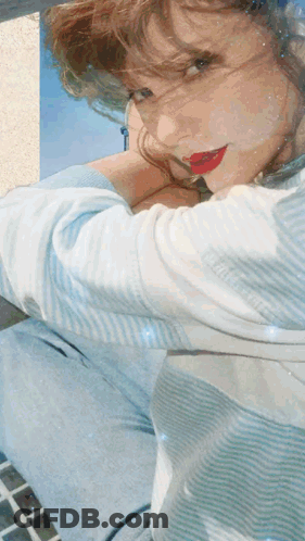 Woman In Blue And White Striped Shirt With Red Lipstick GIF