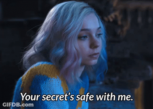 A Woman In A Blue And Yellow Sweater Says " Your Secret 'S Safe With Me " GIF