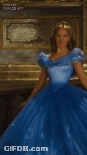 A Woman In A Blue Ball Gown Is Standing In A Room GIF