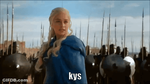 A Woman In A Blue Cape Is Standing In Front Of A Crowd Of Soldiers And The Word Kys Is On The Bottom GIF
