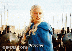 A Woman In A Blue Cape Is Standing In Front Of A Group Of Soldiers And Says " Dracarys " GIF