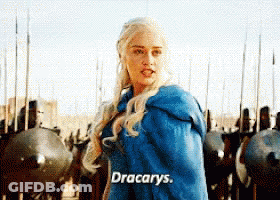 A Woman In A Blue Cape Says Dracarys In Front Of A Row Of Soldiers GIF