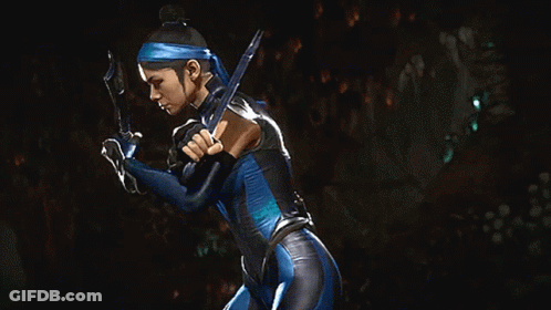 A Woman In A Blue Costume Is Holding A Sword In Her Hands GIF