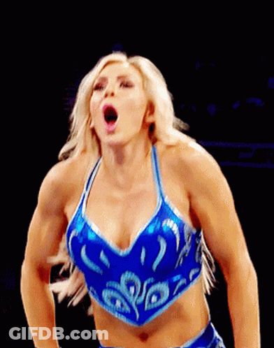 A Woman In A Blue Crop Top Is Making A Face GIF