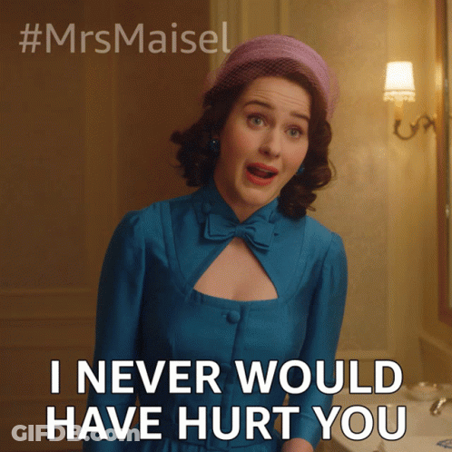 A Woman In A Blue Dress And A Pink Hat Says I Never Would Have Hurt You GIF