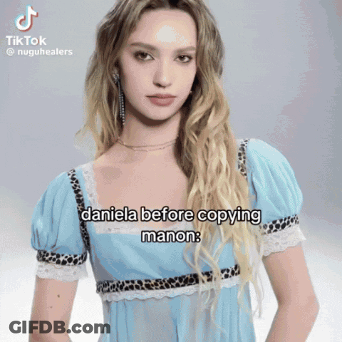 A Woman In A Blue Dress Has A Tiktok Video Of Daniela Before Copying Manon GIF