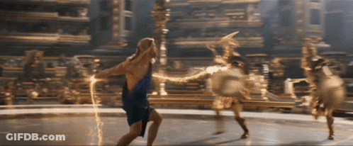 A Woman In A Blue Dress Holds A Lightning Bolt In Her Hand GIF