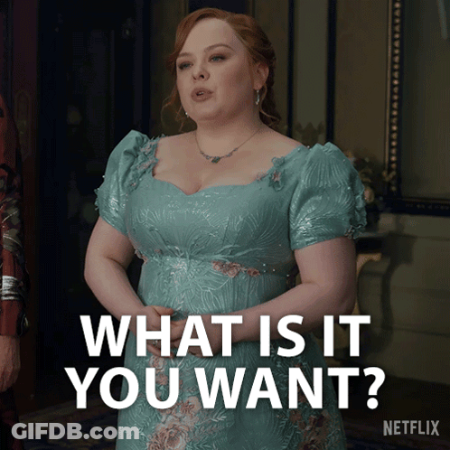 A Woman In A Blue Dress Is Asking " What Is It You Want " GIF