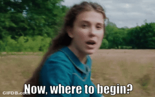 A Woman In A Blue Dress Is Asking Where To Begin GIF