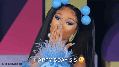 A Woman In A Blue Dress Is Blowing A Kiss And Saying Happy Birthday Sis . GIF