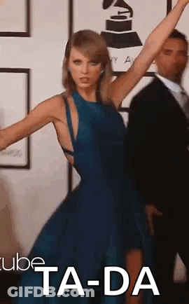 A Woman In A Blue Dress Is Dancing With Her Arms In The Air . GIF