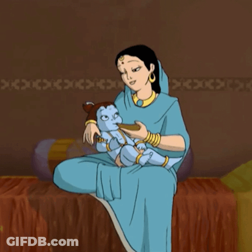 A Woman In A Blue Dress Is Holding A Baby GIF