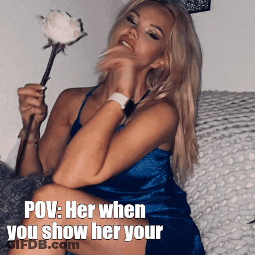 A Woman In A Blue Dress Is Holding A White Rose And The Caption Says Pov Her When You Show Her Your GIF