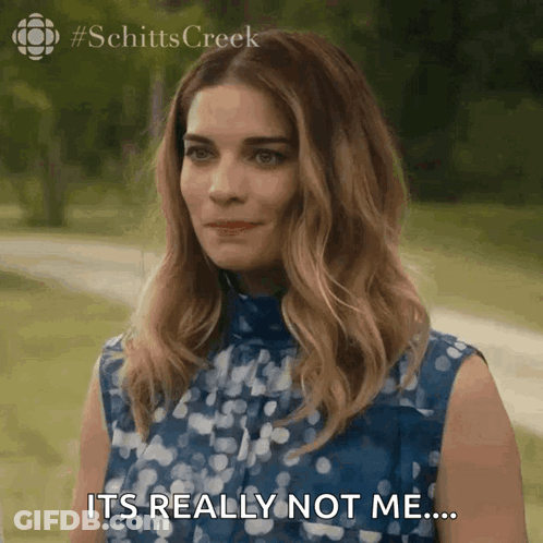 A Woman In A Blue Dress Is Saying It 'S Really Not Me ... GIF