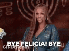 A Woman In A Blue Dress Is Smiling And Saying `` Bye Felicia ! Bye '' . GIF