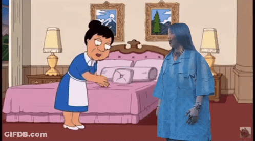 A Woman In A Blue Dress Is Standing Next To A Woman In A Blue Dress GIF