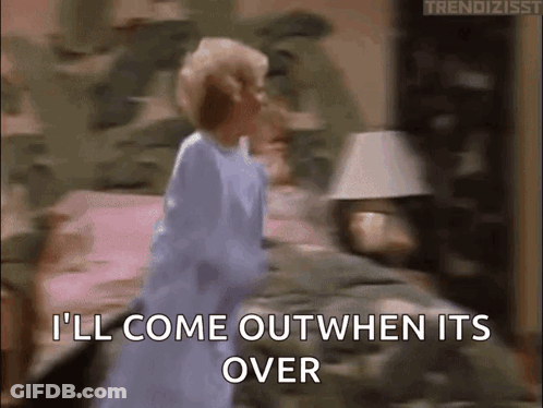 A Woman In A Blue Dress Is Standing On A Bed And Says I 'Ll Come Out When It 'S Over GIF