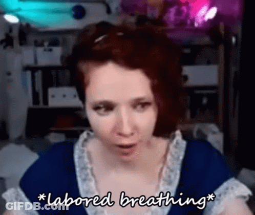 A Woman In A Blue Dress Is Talking About Labored Breathing . GIF