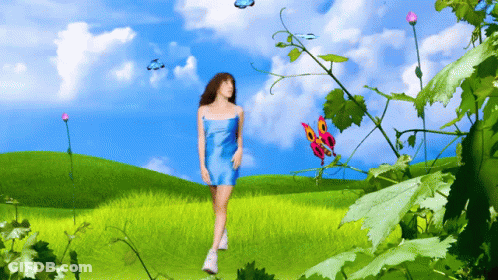 A Woman In A Blue Dress Is Walking Through A Field With Butterflies Flying Around Her GIF
