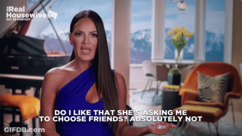 A Woman In A Blue Dress Says Do I Like That She 'S Asking Me To Choose Friends ? Absolutely Not GIF