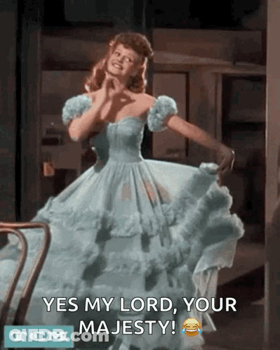 A Woman In A Blue Dress Says Yes My Lord Your Majesty Tcm GIF
