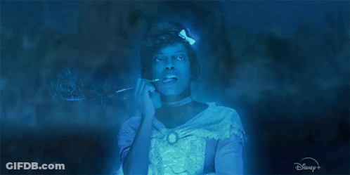 A Woman In A Blue Dress With A Disney Logo GIF