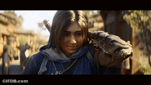 A Woman In A Blue Hoodie Is Holding A Sword On Her Shoulder GIF