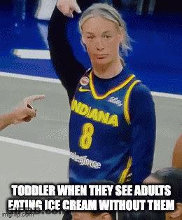 A Woman In A Blue Indiana Jersey Is Pointing At A Child GIF