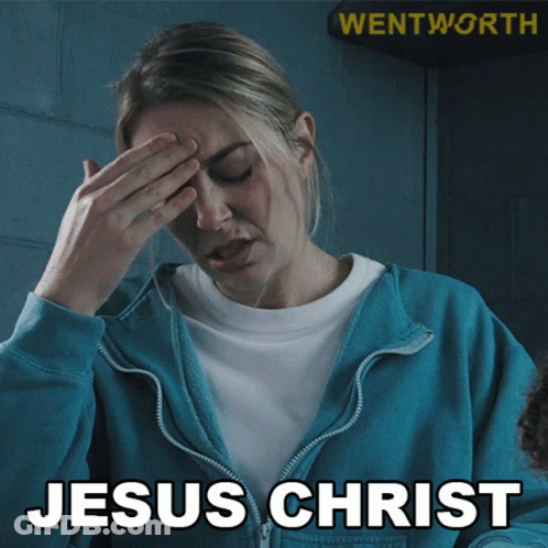 A Woman In A Blue Jacket Covering Her Face With Her Hand And The Words Jesus Christ Written Below Her GIF