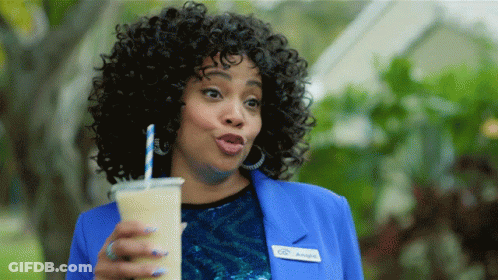 A Woman In A Blue Jacket Has A Name Tag That Says Angie GIF