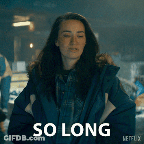 A Woman In A Blue Jacket Is Standing In Front Of A Sign That Says So Long By Netflix GIF