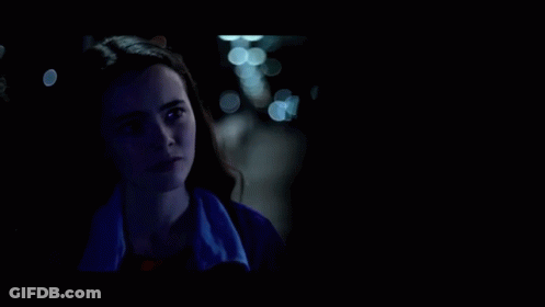 A Woman In A Blue Jacket Is Talking To Another Woman In A Dark Room And Says `` Did You Ever Love Me '' . GIF