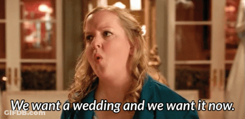 A Woman In A Blue Jacket Says We Want A Wedding And We Want It Now GIF
