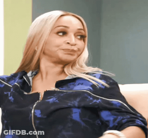 A Woman In A Blue Jacket With The Letter M On The Front GIF