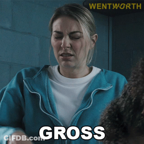 A Woman In A Blue Jacket With The Word Gross On Her Chest GIF