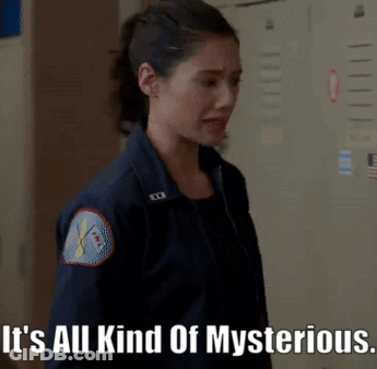 A Woman In A Blue Jacket With The Words It 'S All Kind Of Mysterious GIF