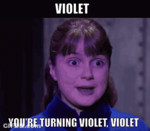 A Woman In A Blue Jacket With The Words Violet You 'Re Turning Violet Violet On The Bottom GIF