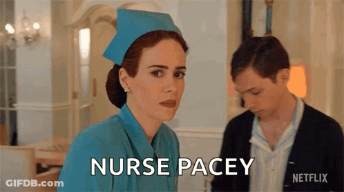 A Woman In A Blue Nurse 'S Uniform Is Standing Next To A Man And Says Nurse Pacey GIF