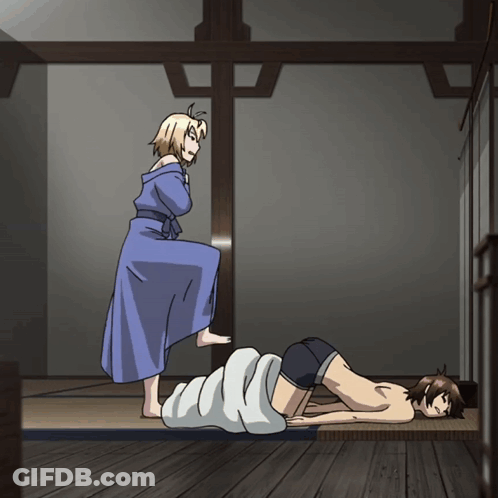A Woman In A Blue Robe Is Standing Next To A Man Laying On A Bed GIF
