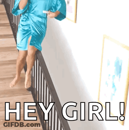 A Woman In A Blue Robe Is Standing On A Railing With The Words Hey Girl Written On The Bottom GIF