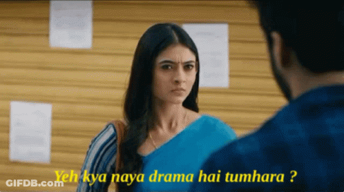 A Woman In A Blue Saree Is Looking At A Man In A Blue Shirt And Says Yeah Kya Naya Drama Hai Tumhara GIF