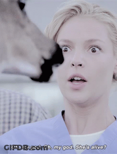 A Woman In A Blue Scrub Says Oh My God GIF
