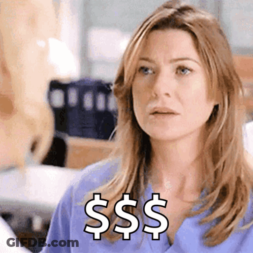 A Woman In A Blue Scrub Top Has A Dollar Sign On Her Chest GIF