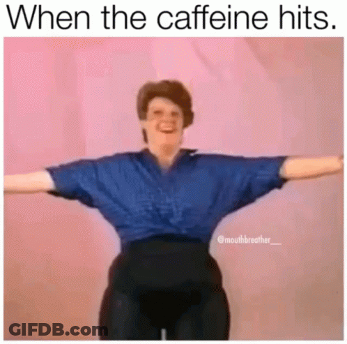 A Woman In A Blue Shirt And Black Pants Is Standing With Her Arms Outstretched In A Meme . GIF