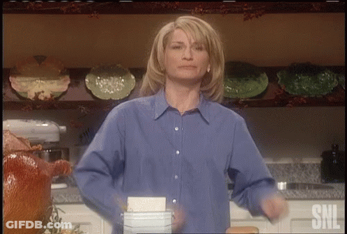 Woman In Blue Shirt Dancing In Kitchen GIF