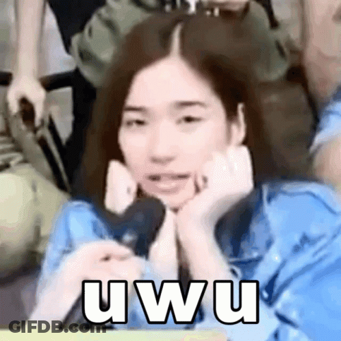 A Woman In A Blue Shirt Is Making A Funny Face With Her Hands On Her Face And The Words Uwu On The Bottom GIF