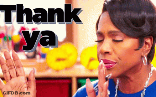 A Woman In A Blue Shirt Is Making A Thank You Gesture GIF
