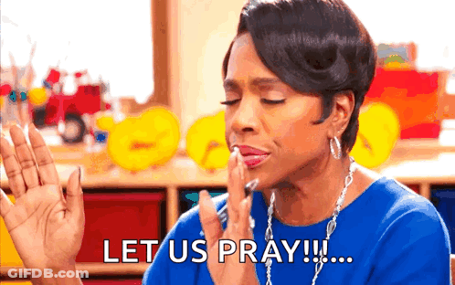 A Woman In A Blue Shirt Is Saying Let Us Pray . GIF